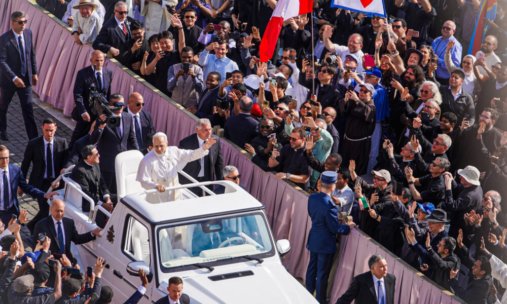 Pope Leo XIV at his inauguration, shown riding the Pope-mobile