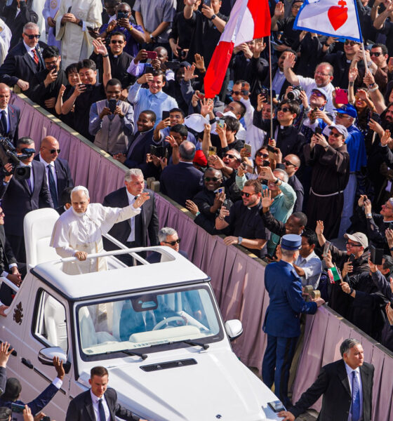 Pope Leo XIV at his inauguration, shown riding the Pope-mobile