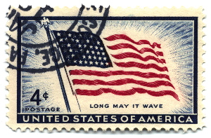 A 1957 four-cent stamp with the American flag