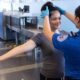 TSA officer searching an airline passenger's hair