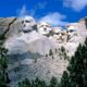 Mount Rushmore showing Presidents Washington, Jefferson, T. Roosevelt, and Lincoln (left to right)