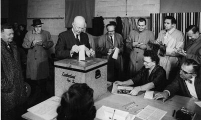 Eisenhower, as President, casts a ballot - a paper ballot