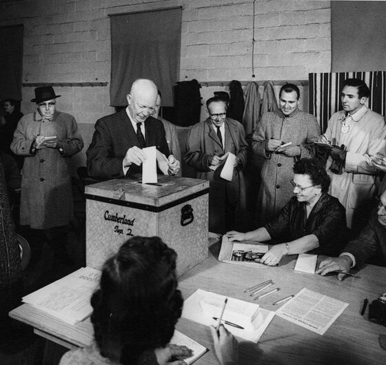 Eisenhower, as President, casts a ballot - a paper ballot