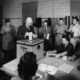 Eisenhower, as President, casts a ballot - a paper ballot