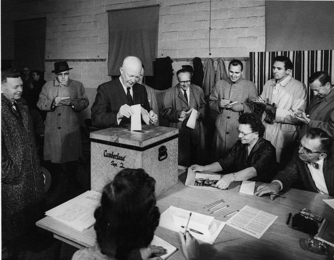 Eisenhower, as President, casts a ballot - a paper ballot