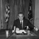 Lyndon Baines Johnson, as President, signs the Gulf of Tonkin Resolution