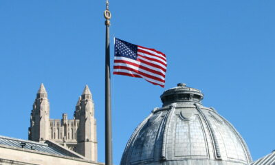 The American Flag flies from the flagpole in Hewitt Quadrangle at Yale University. Buildings shown include the Yale Commons (left foreground), the dome of Theodore Dwight Woolsey Memorial Hall (wherein are inscribed the names of every Yale graduate who ever fell in battle, including President Franklin D. Roosevelt in the WWII memorial section), and the top of Sterling Tower (background, across the intersection of College, Grove, and Prospect Streets). Note: Sheffield-Sterling-Strathcona Hall (abbreviated SSS) is the headquarters of the School of Engineering.