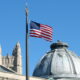 The American Flag flies from the flagpole in Hewitt Quadrangle at Yale University. Buildings shown include the Yale Commons (left foreground), the dome of Theodore Dwight Woolsey Memorial Hall (wherein are inscribed the names of every Yale graduate who ever fell in battle, including President Franklin D. Roosevelt in the WWII memorial section), and the top of Sterling Tower (background, across the intersection of College, Grove, and Prospect Streets). Note: Sheffield-Sterling-Strathcona Hall (abbreviated SSS) is the headquarters of the School of Engineering.