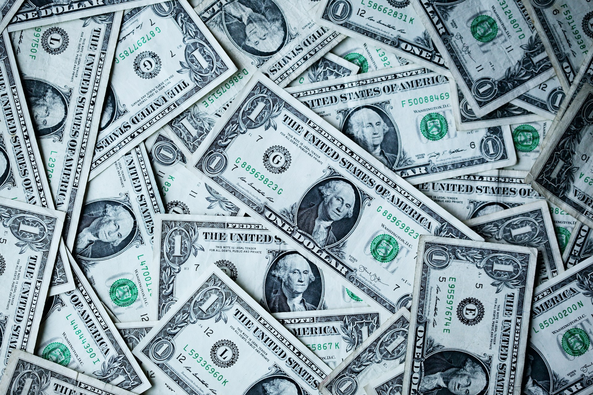 Photo of one-dollar bills by Alexander Gray on Unsplash