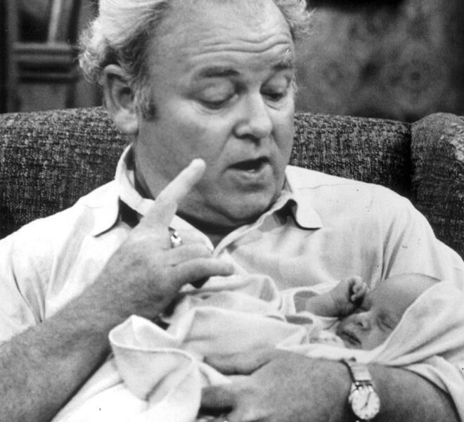 Archie Bunker sits in his favorite chair making a point, in a rare snapshot published without a copyright notice at a time when copyright notices mattered