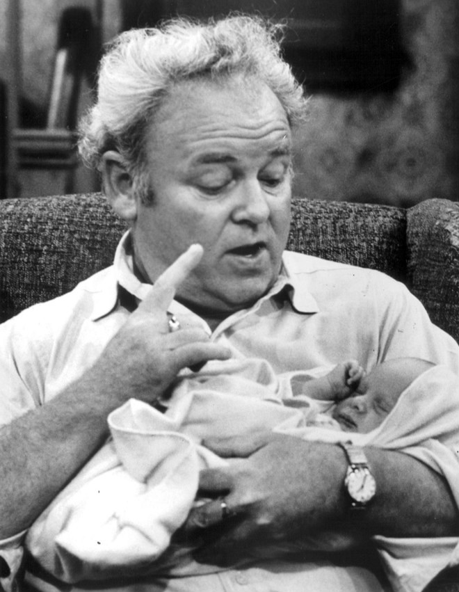 Archie Bunker sits in his favorite chair making a point, in a rare snapshot published without a copyright notice at a time when copyright notices mattered