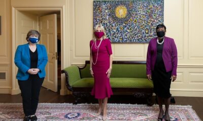 Randi Weingarten, Jill Biden EdD, and Becky Pringle, all wearing color-coordinated masks.