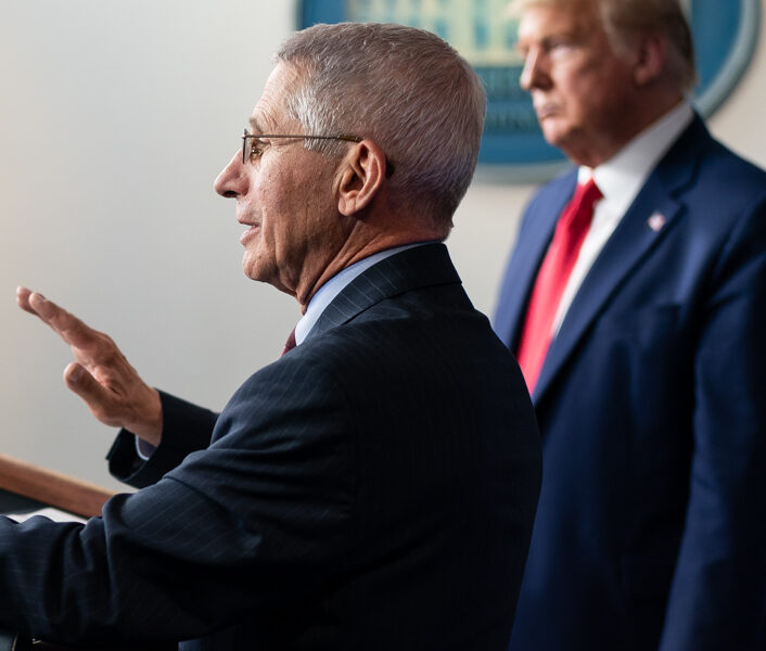 Anthony Fauci (foreground) and Donald Trump