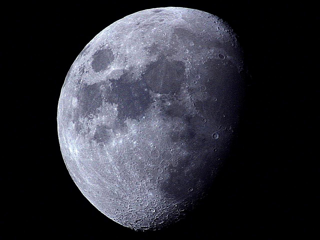 The Moon, in waning Gibbous phase, against a night sky