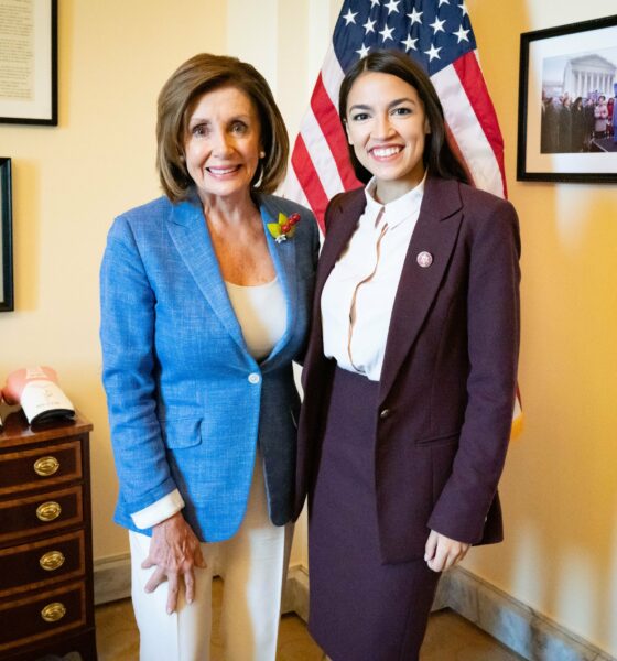 Representative Alexandria Ocasio-Cortez (D-N.Y.) poses with Rep. Nancy Pelosi (D-Calif.), then Speaker of the House, in the Speaker's office.