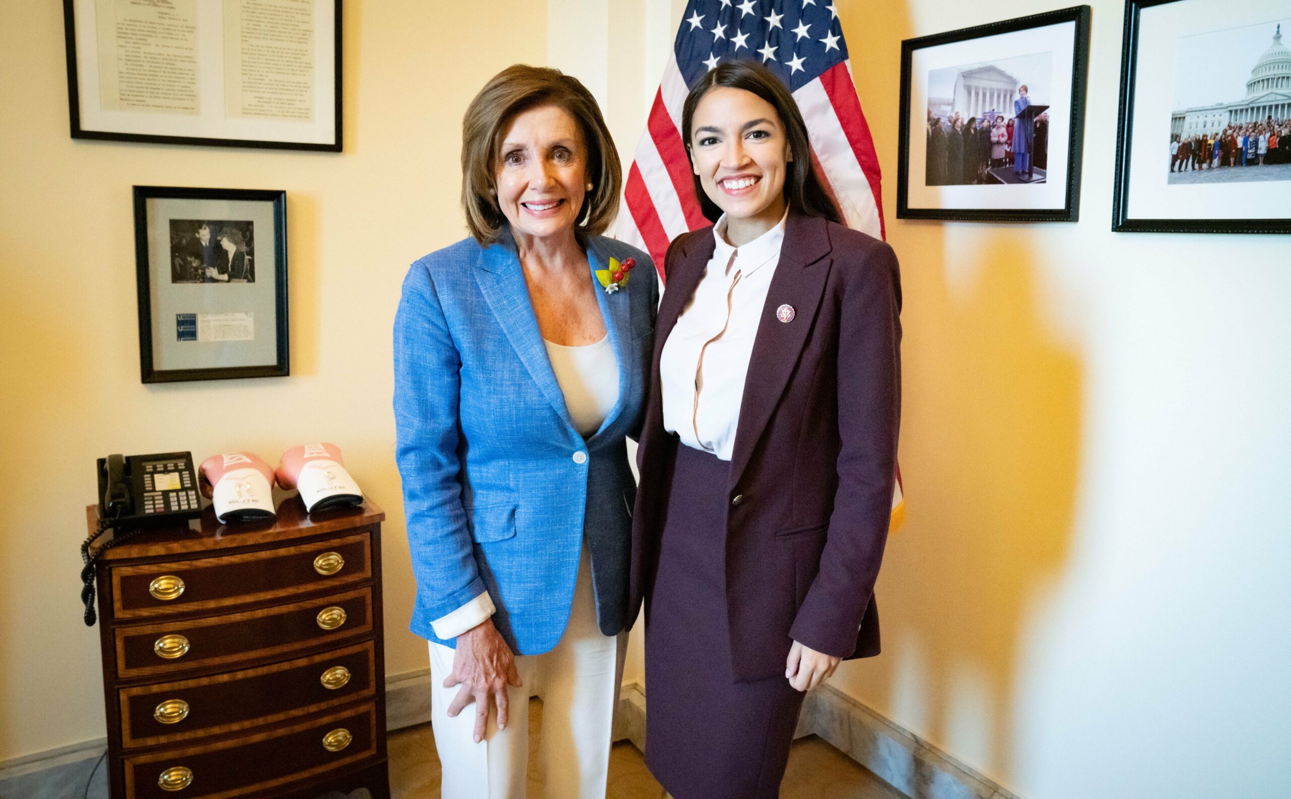 Representative Alexandria Ocasio-Cortez (D-N.Y.) poses with Rep. Nancy Pelosi (D-Calif.), then Speaker of the House, in the Speaker's office.