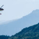 A helicopter prepares to drop water onto the Waldo Canyon Fire in Colorado Springs, Colorado in 2012