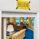 Believe sign over Oval Office door, referring to a visit from the cast of the Ted Lasso show.