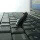Keyboard with pen lying across it