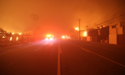 Looking down a street during the Palisades Fire